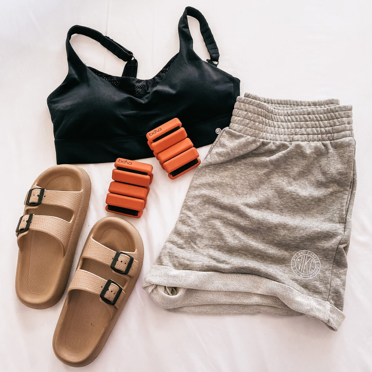 My must -have picks for yoga and physical therapy. Sports bra, weights, sandals and shorts
