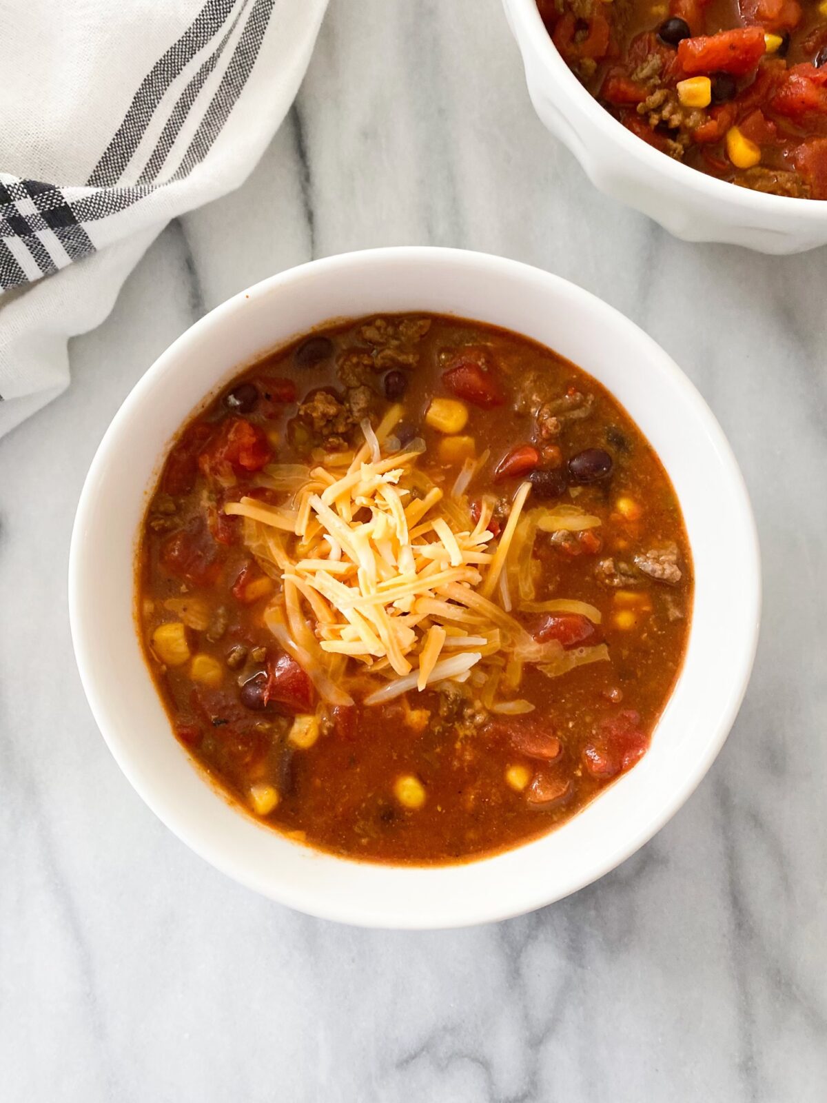 crockpot taco soup is an easy recipe of tomatoes, corn, beans and meat in a savory broth