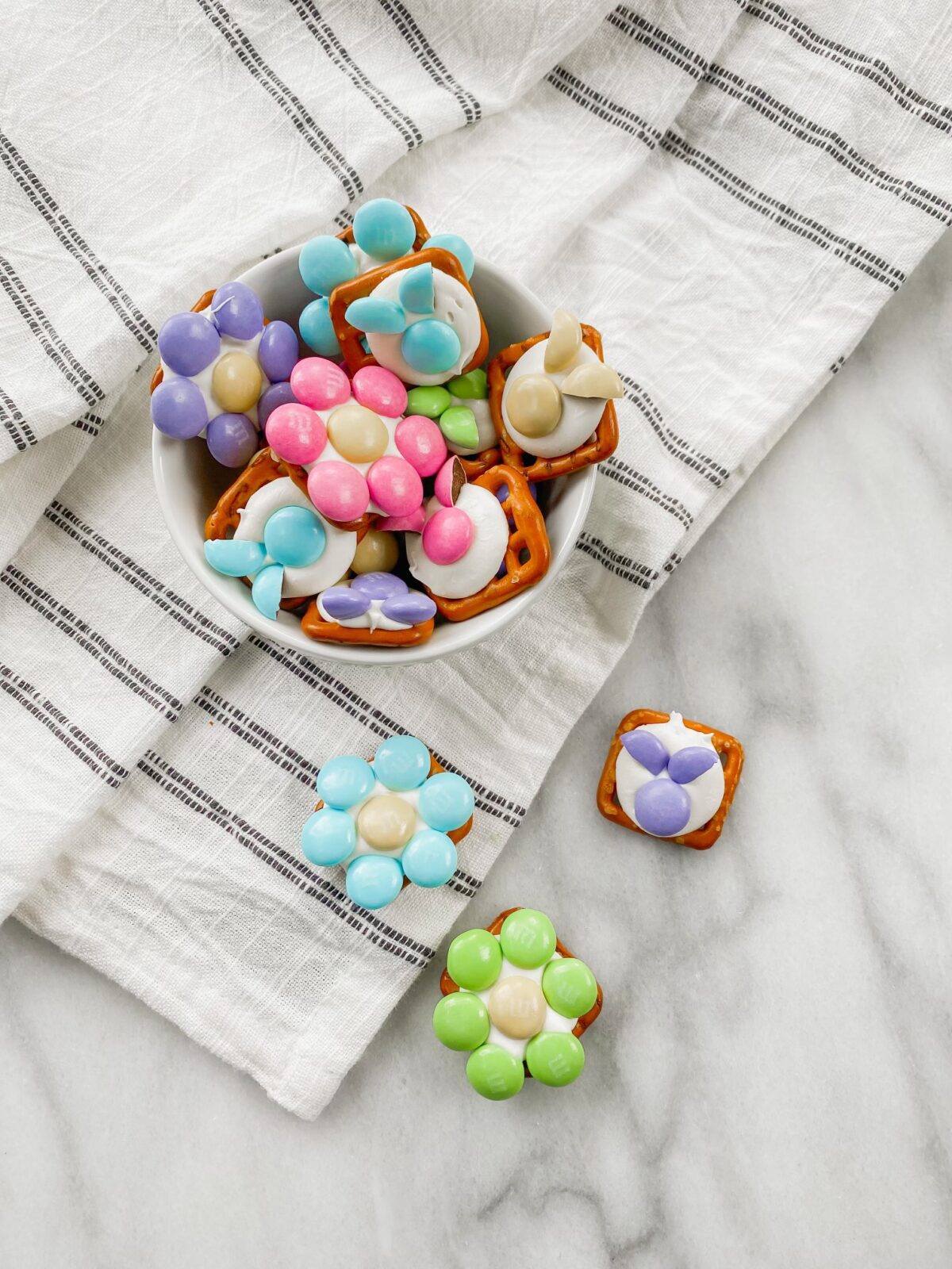 adorable spring treats made from pretzels and M&Ms are perfect for Easter and other spring gatherings

